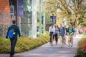 Photo of students on campus. Link to Anonymous School of Education Alum Gives Back story