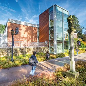 Students walking in front of campus building.Read about Gifts of Cash, Checks, and Credit Cards Students walking in front of campus building.Read about Gifts of Cash, Checks, and Credit Cards